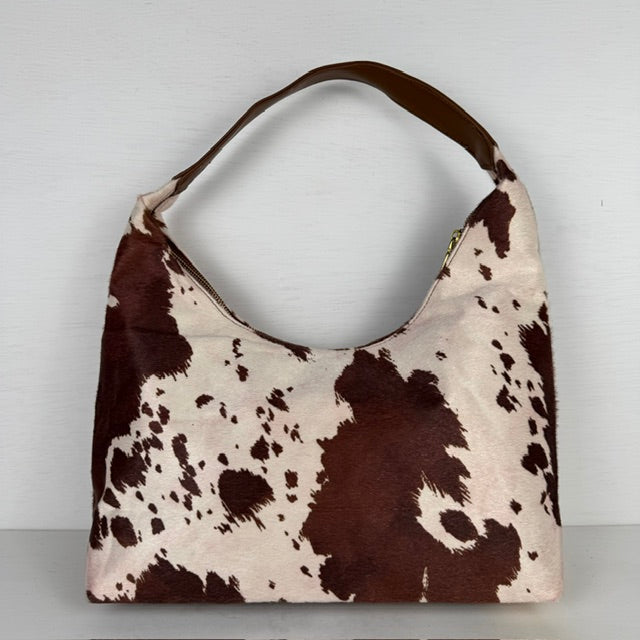 Geweldige schoudertas met koeienprint