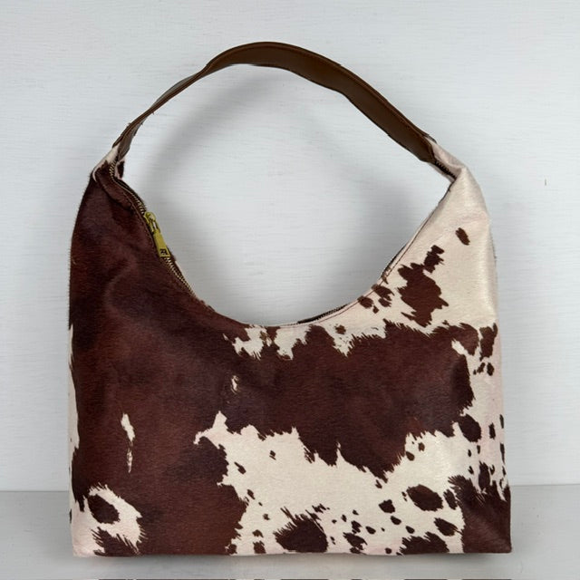 Geweldige schoudertas met koeienprint