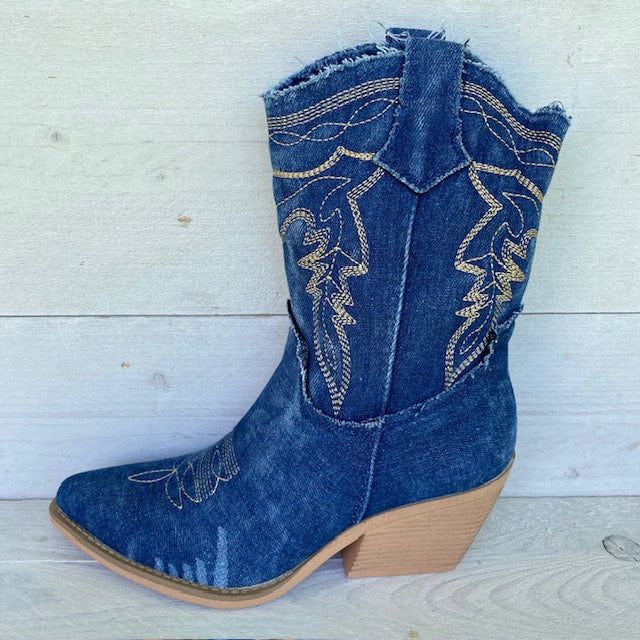 Cowboylaarzen donker blauw jeans met goudkleurig stiksel